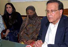 Governor Salman Taseer and family visiting Asia Bibi in jail.