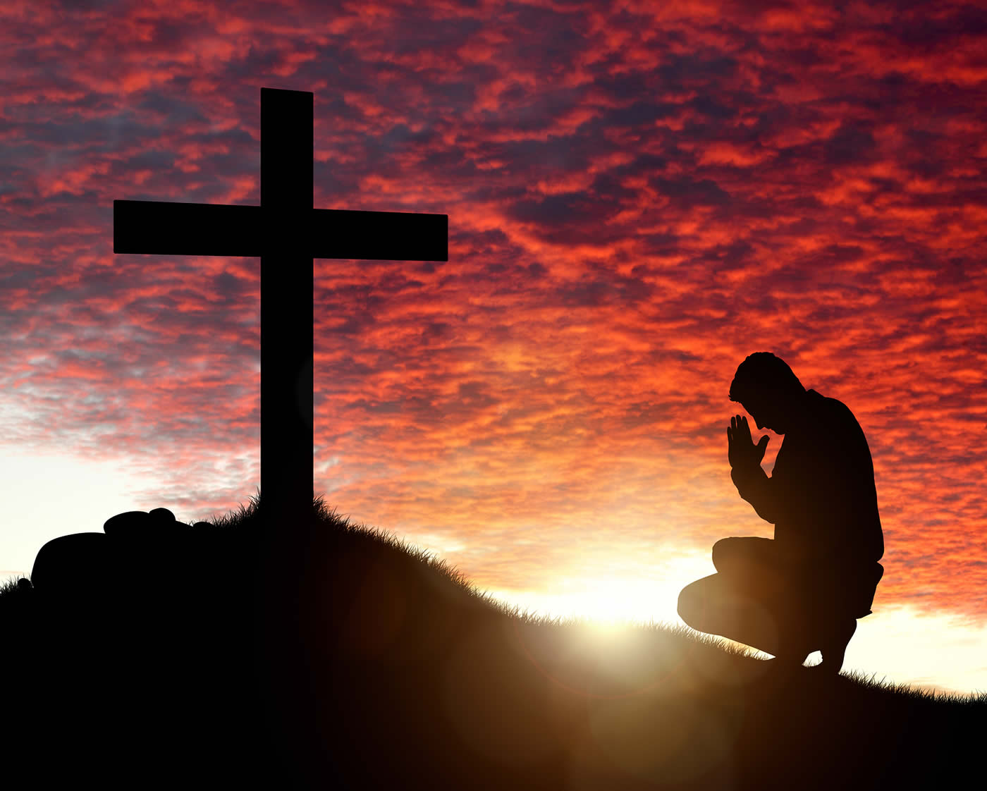 Man Praying before Cross